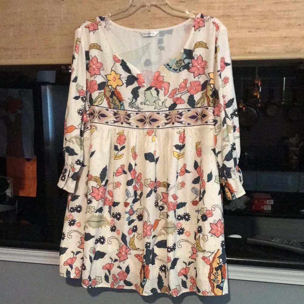 Cream colored top with floral pattern
